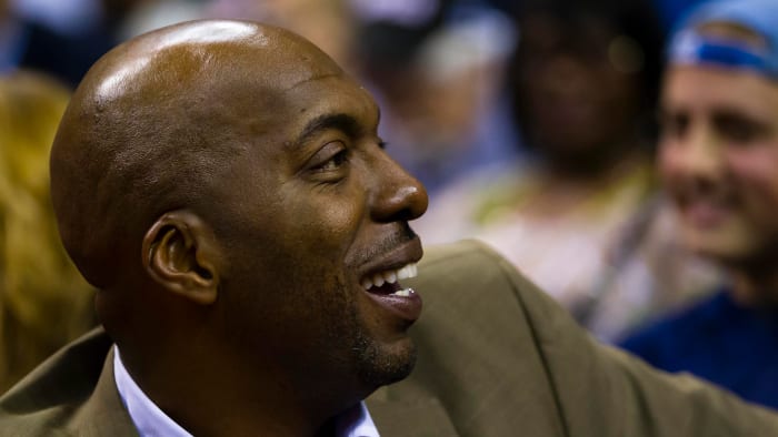 John Salley watches a game between the Detroit Pistons and the Philadelphia 76ers in 2012